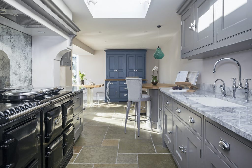 freestanding blue larder cupboard in luxury kitchen design